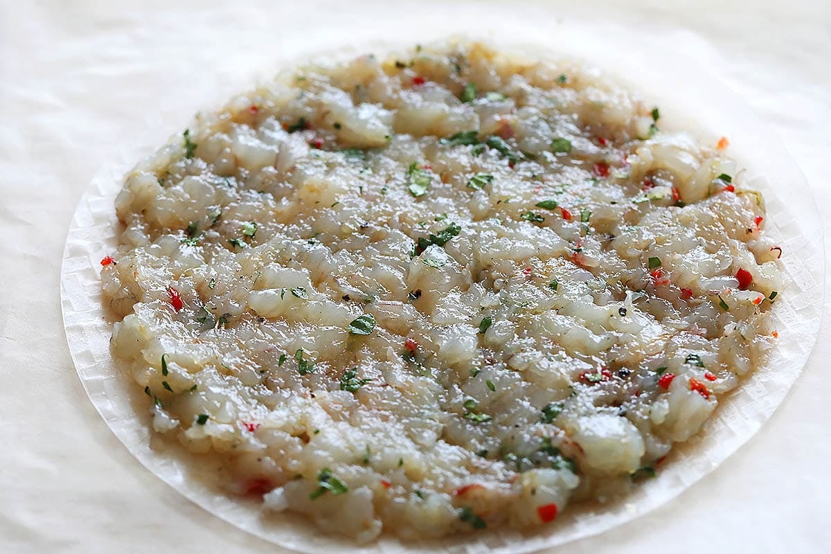 Shrimp mixture evenly spread on a rice paper.