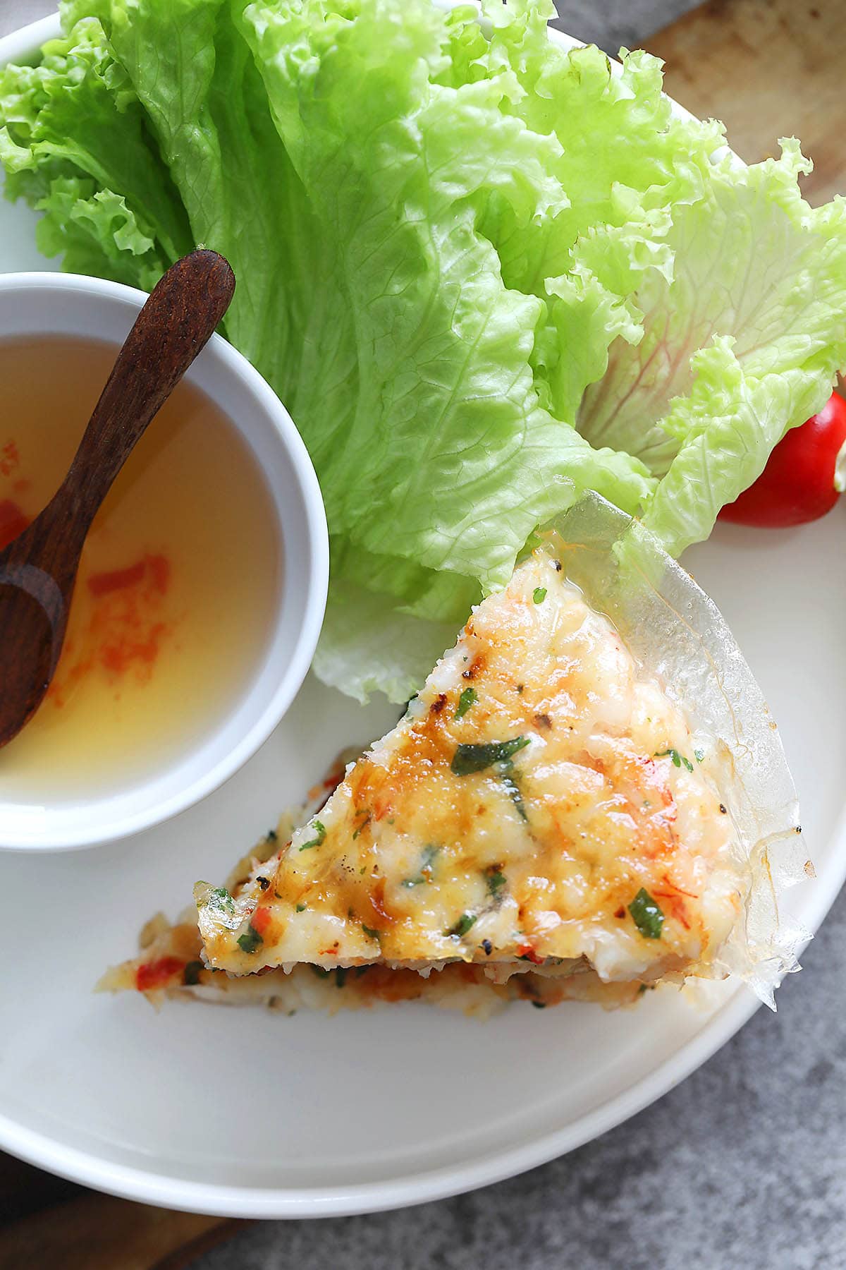 Vietnamese shrimp cake served with lettuce and Vietnamese dipping sauce (nuoc cham).