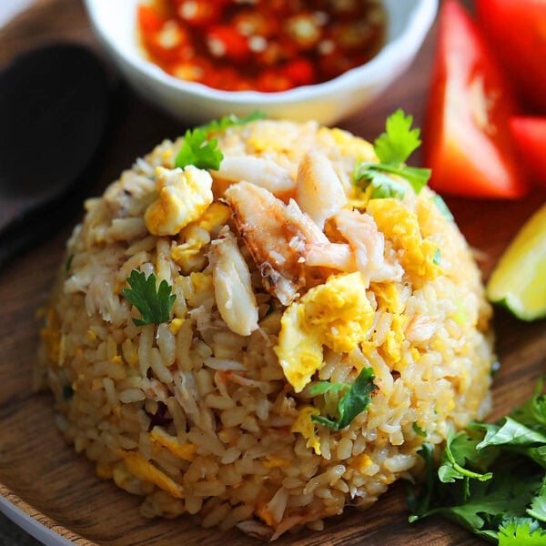 Crab fried rice recipe garnished with cilantro.