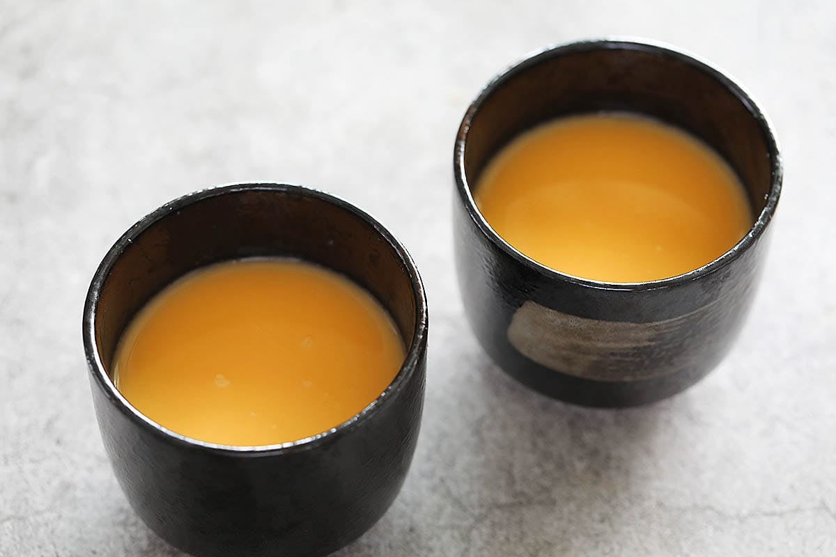 Strained egg mixture in chawanmushi cups.