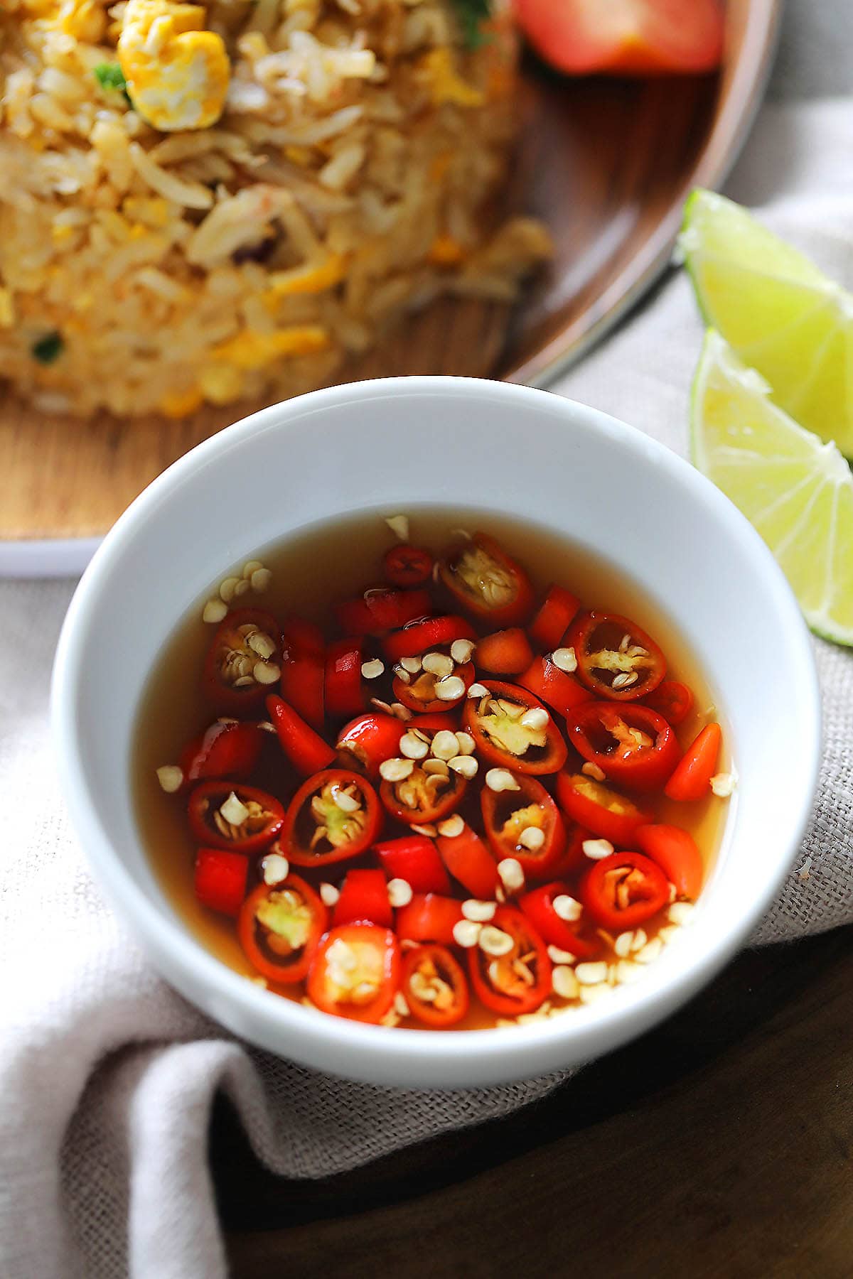 Prik nam pla made with Thai fish sauce, bird's eye chilies and lime juice.
