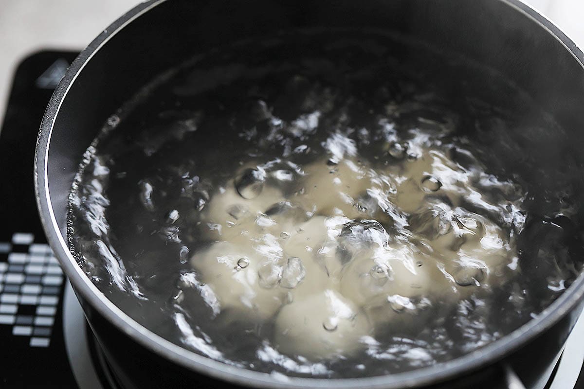 Dango in a pot of boiling water.