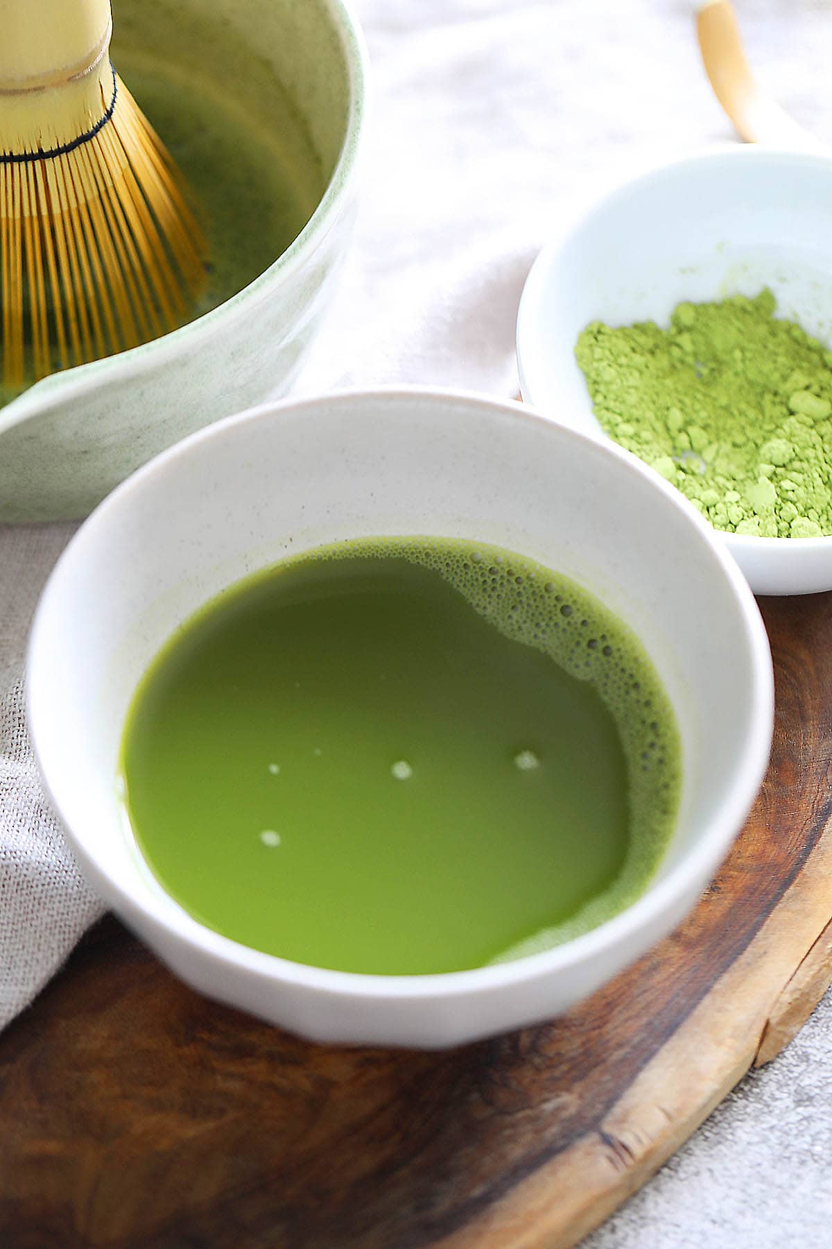 How to make matcha, freshly whisked matcha in a bowl.