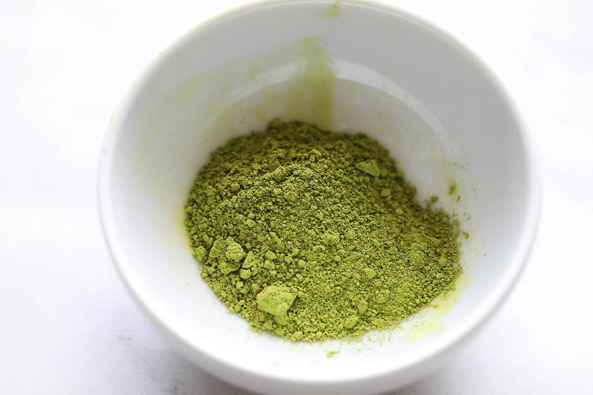 Matcha powder in a small bowl.