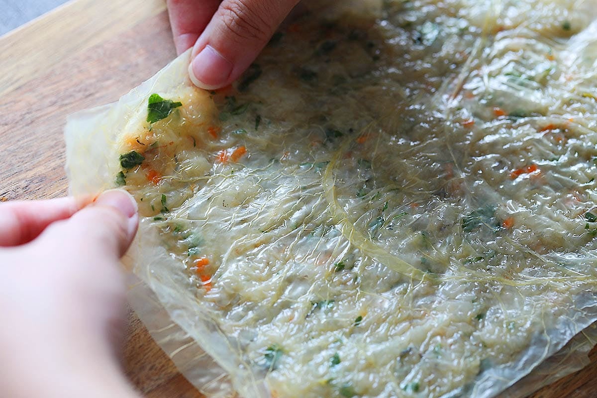 Edges of the prawn cake being sealed.