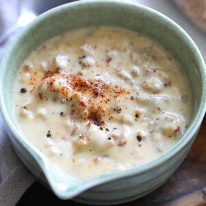 Homemade sausage gravy recipe topped with cayenne pepper.