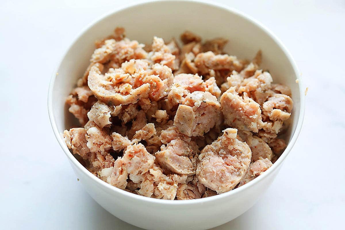 Small pieces of pork sausages in a bowl.