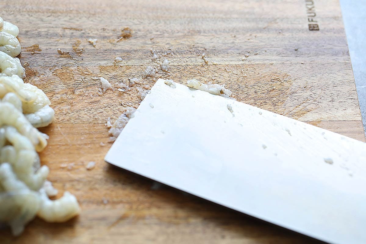 Chinese cleaver on a shrimp.