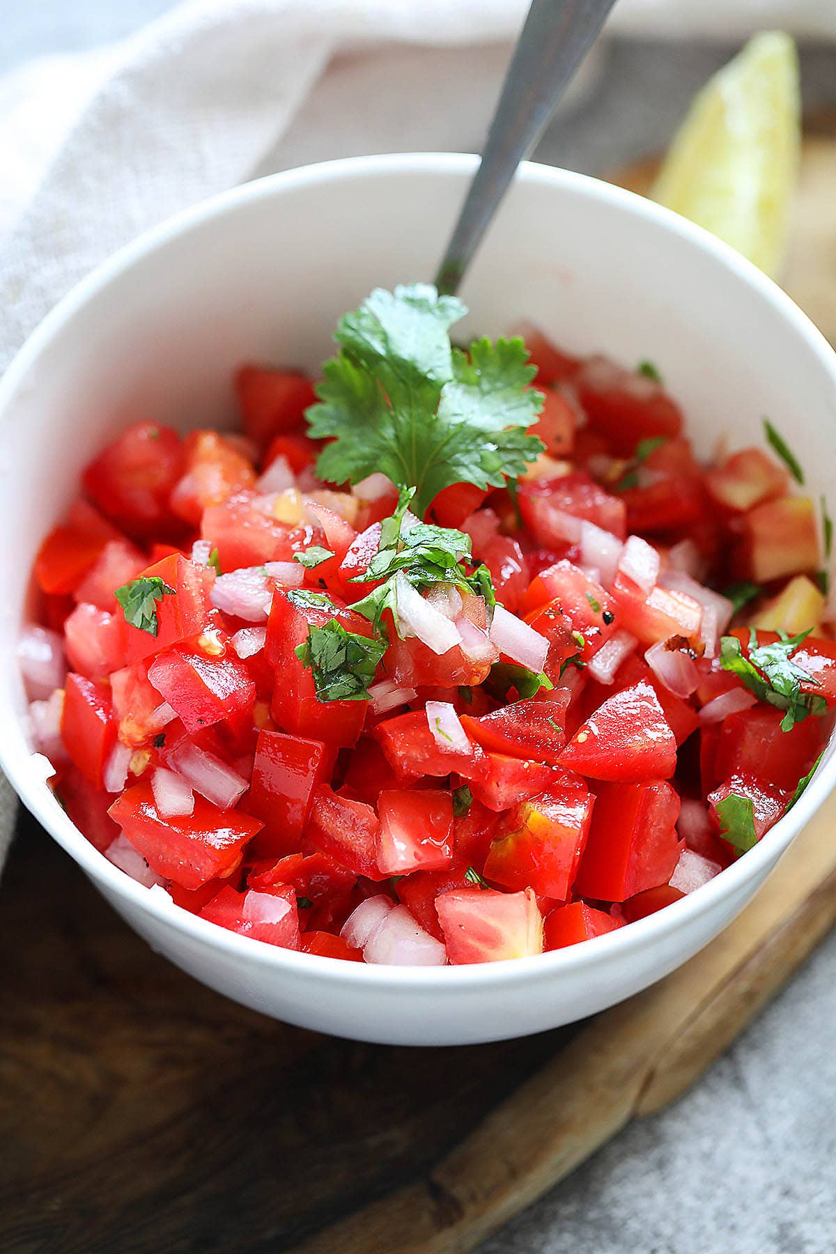 Homemade fresh tomato salsa served in a bowl.