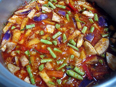 Perut Ikan / Nyonya Fermented Fish Stomach Curry - Saute the spice paste and add in pineapples, green beans, and eggplants