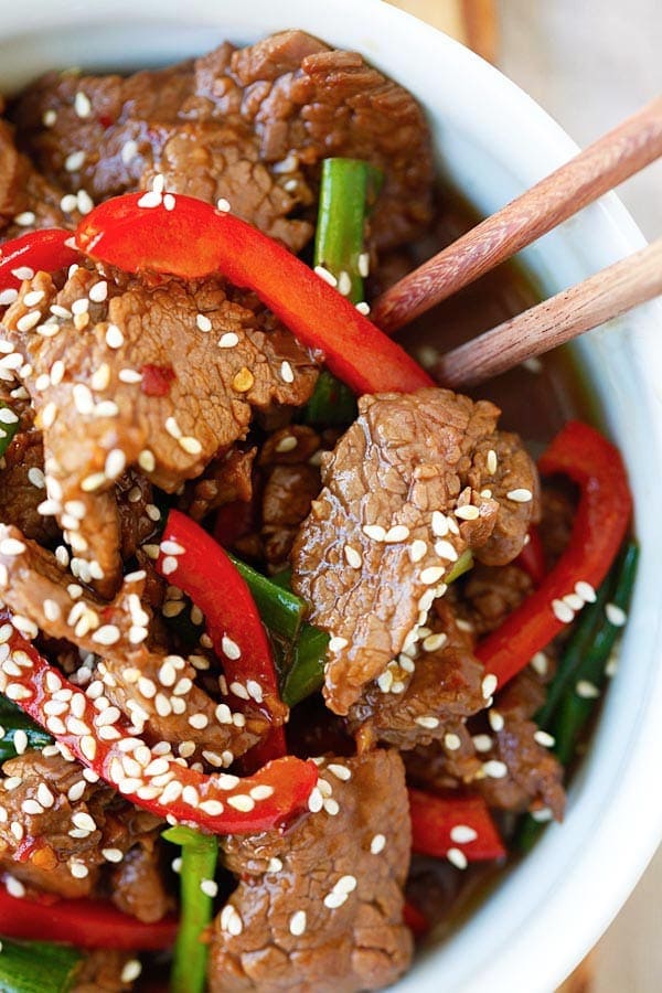 Asian stir-fry sesame beef homemade brown sauce close up.